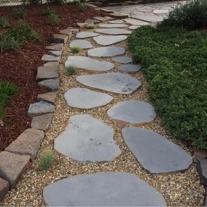 Natural stone stepping stones in a garden pathway